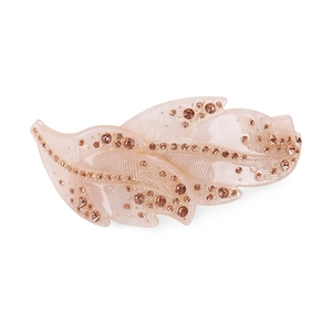 Close-up of pink leaf hair clip with rhinestones and elegant resin texture finish