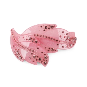 Detailed macro view of pink leaf-shaped hair clip with sparkling acrylic rhinestones