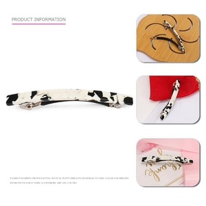Classic black and white marble acetate spring hair clip with elegant glossy finish for women