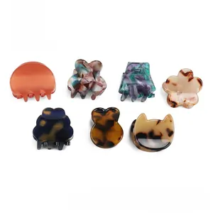 Collection détaillée de pinces à cheveux en acétate aux motifs marbre et écaille
