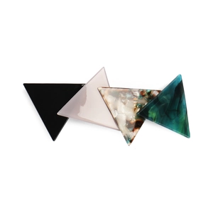 Close-up of geometric acetate hair clip featuring multi-color triangular pattern design