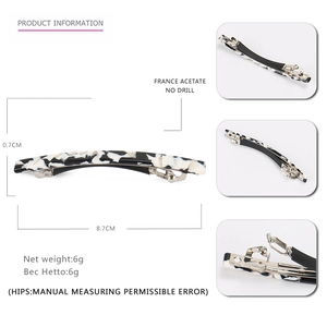 French acetate hair clip with black and white marble pattern and metal spring clip
