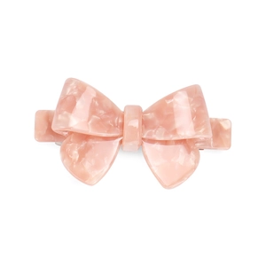 Detail view of the pink marbled acetate hair clip with a layered bow design