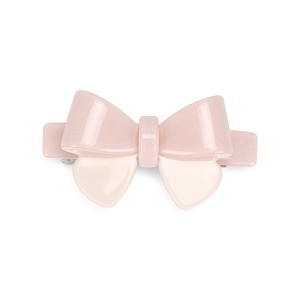Detail of light pink acetate bow hair clip with a subtle pearlescent glitter finish
