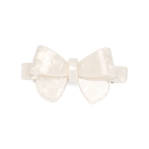 Detail of marble pattern acetate hair clip with a classic bow design and metal spring clip