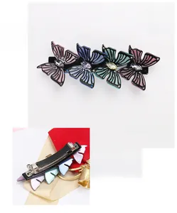 Detailed view of acetate butterfly hair clip with crystal inlay and 10.5cm spring clip