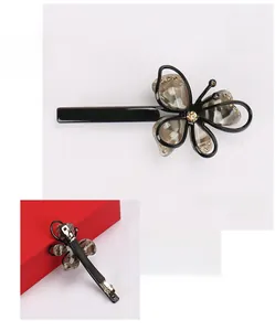 Detail view of acetate butterfly hair clip with sparkling Austrian crystals and spring clamp