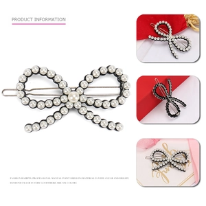 Barrette à cheveux avec nœud en perles blanches sur base en alliage noir chic