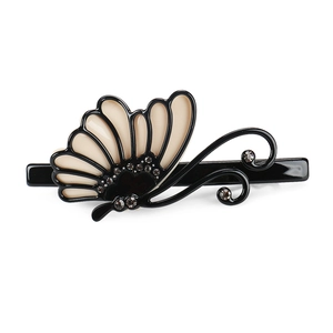 Detailed close-up of a butterfly hair clip with Czech rhinestones on acetate wings