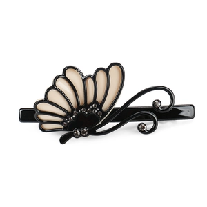 Elegant butterfly hair clip with beige finish and Czech rhinestones on white background