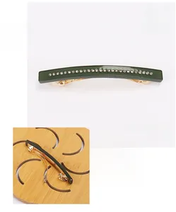 Detail of green acetate hair clip with rhinestones and 8x0.8cm size measurements