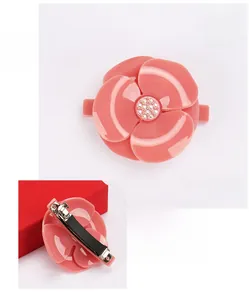 Pink camellia acrylic hair clip with Austrian crystals and metal spring mechanism