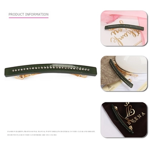 Elegant green acetate hair clip with crystal rhinestones on a gold metal spring base