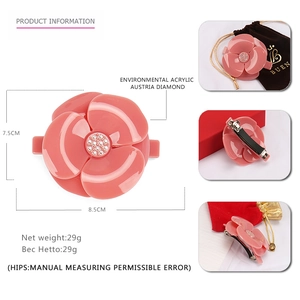 Pink acrylic camellia hair clip with Austrian rhinestones and velvet pouch accessory