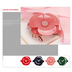 Classic camellia flower hair clip with resin petals and sparkling rhinestone center