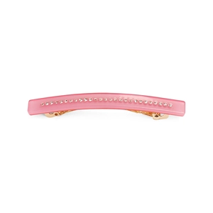 Close-up of pink acetate spring hair clip with a row of small matching rhinestones