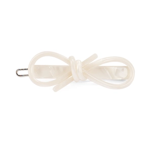 Elegant cream white acetate bow hair clip with silver metal alligator base on white background