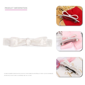 Barrette à cheveux élégante en forme de nœud crème avec texture marbrée et ressort