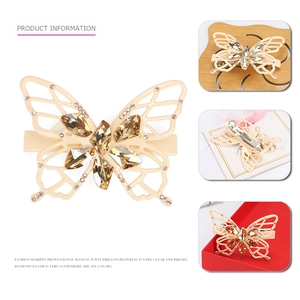 Elegant hollow butterfly hair clip with amber crystals and silver duckbill metal clip