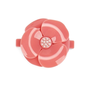 Elegant coral pink camellia hair clip with sparkling crystal center on white backdrop