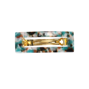 Acetate hair clip with green marble pattern and gold metal spring closure for women
