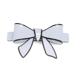 Large blue acrylic hair clip with cartoon style black edges and sleek bow design