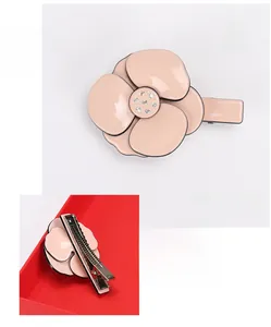 Detail of pink acetate camellia hair clip with Austrian rhinestones and metal clip