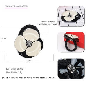 Acetate camellia hair tie with Austrian crystals and black elastic cord for women