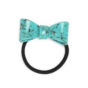 Detail of turquoise marble acetate bow hair tie with high-elastic black cord