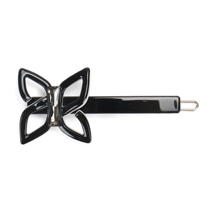Close-up of a black butterfly hair clip with a grey rectangular crystal on a white background