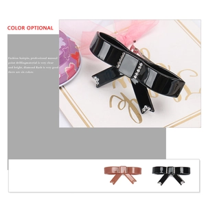 Elegante fermaglio per capelli in acetato nero con fiocco e strass luccicanti per donna