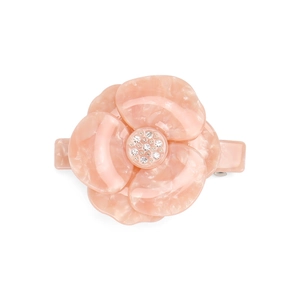 Detail of light pink acetate flower hair clip with sparkling crystal center stone