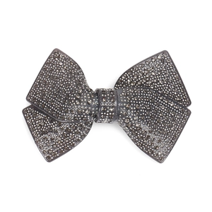Elegant acrylic bow hair clip with dark grey crystals and a sparkling rhinestone finish