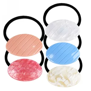 Five-piece set of geometric acrylic hair ties with ribbed oval charms in assorted colors