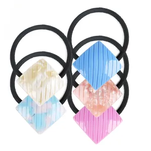 Minimalist geometric textured hair ties set in cream, blue, pink and lavender colors