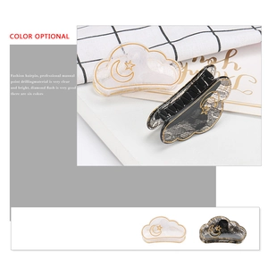 Cloud shaped hair claw clips with lace texture and gold star moon patterns in black and white