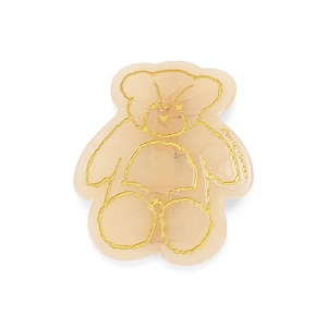 Dettaglio di fermaglio per capelli in acetato rosa con forma di orso e contorno oro
