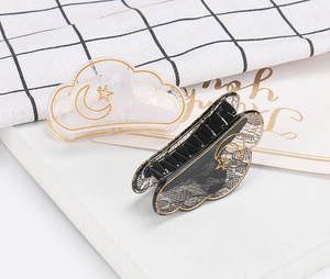 Cloud-shaped hair claws with lace patterns and golden stars and moon motifs