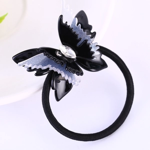 Élastique à cheveux papillon élégant avec base noire et ailes pailletées blanc