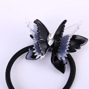 Élastique papillon élégant en acétate noir et blanc orné d'un cristal étincelant