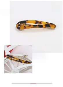 Detail of tortoise shell acetate hair clip with sparkling Austrian rhinestones
