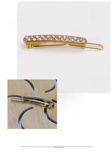 Detail of France acetate hair clip with Austria rhinestones and golden metal clamp