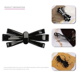 Elegante fermaglio per capelli a fiocco nero in acetato con finitura lucida