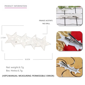 Star shaped acetate hair clip in white marble pattern with dimensions 8.6cm by 2.7cm