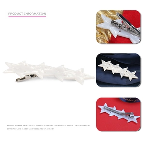 Acetate star hair clip with white marble texture and silver metal duckbill clamp
