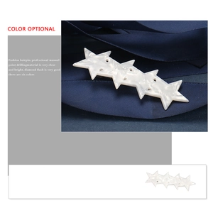 Pentagram acetate hair clip with four white stars and marbled texture on blue ribbon
