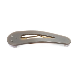 Close-up of acetic acid water drop hair clip with resin texture and rhinestones