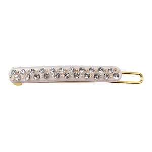 Detailed macro of a rectangular acetate hair clip with dual rows of sparkling rhinestones