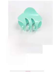 Detail view of mint green acrylic hair claw clip showing dimensions 5.5x4.5cm and texture