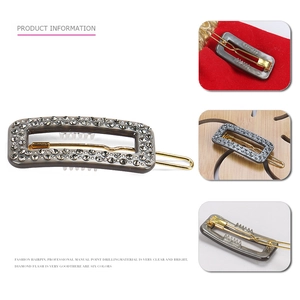 Elegant geometric grey resin hair clip with sparkling rhinestones and gold metal base